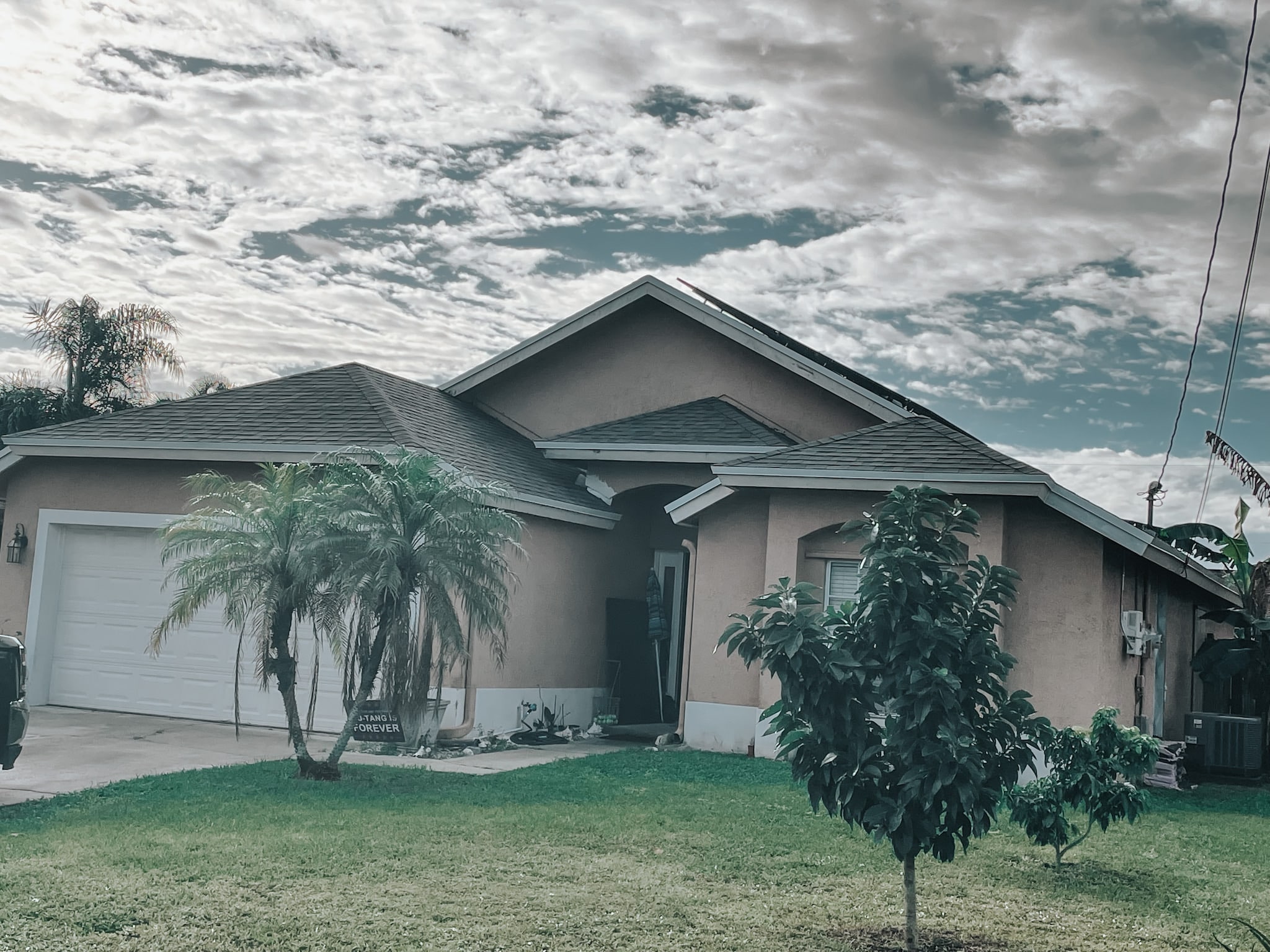 Completed dark French Drains drainage system on a TX home
